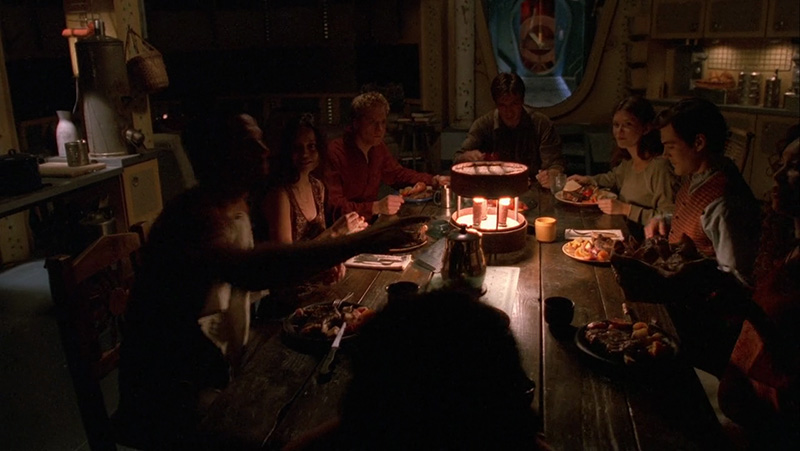 Screencapture of most of the core cast at dinner in the episode “Safe”