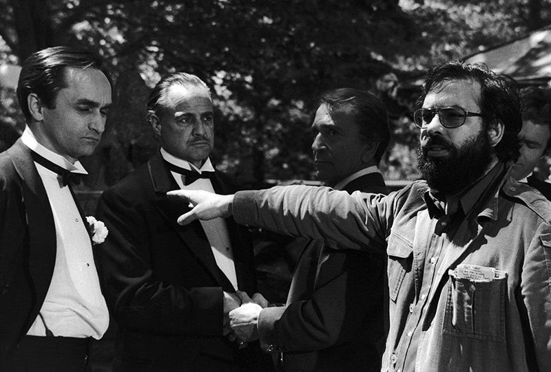 Photo of John Cazale, Marlon Brando, Richard Conte and Francis Ford Coppola filming “The Godfather”